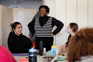 photo of young people smiling at a creative workshop